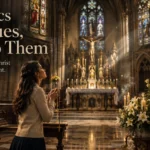 A Catholic woman prays with a rosary before a marble statue of the Blessed Virgin Mary inside a Gothic cathedral beneath a prominent crucifix.